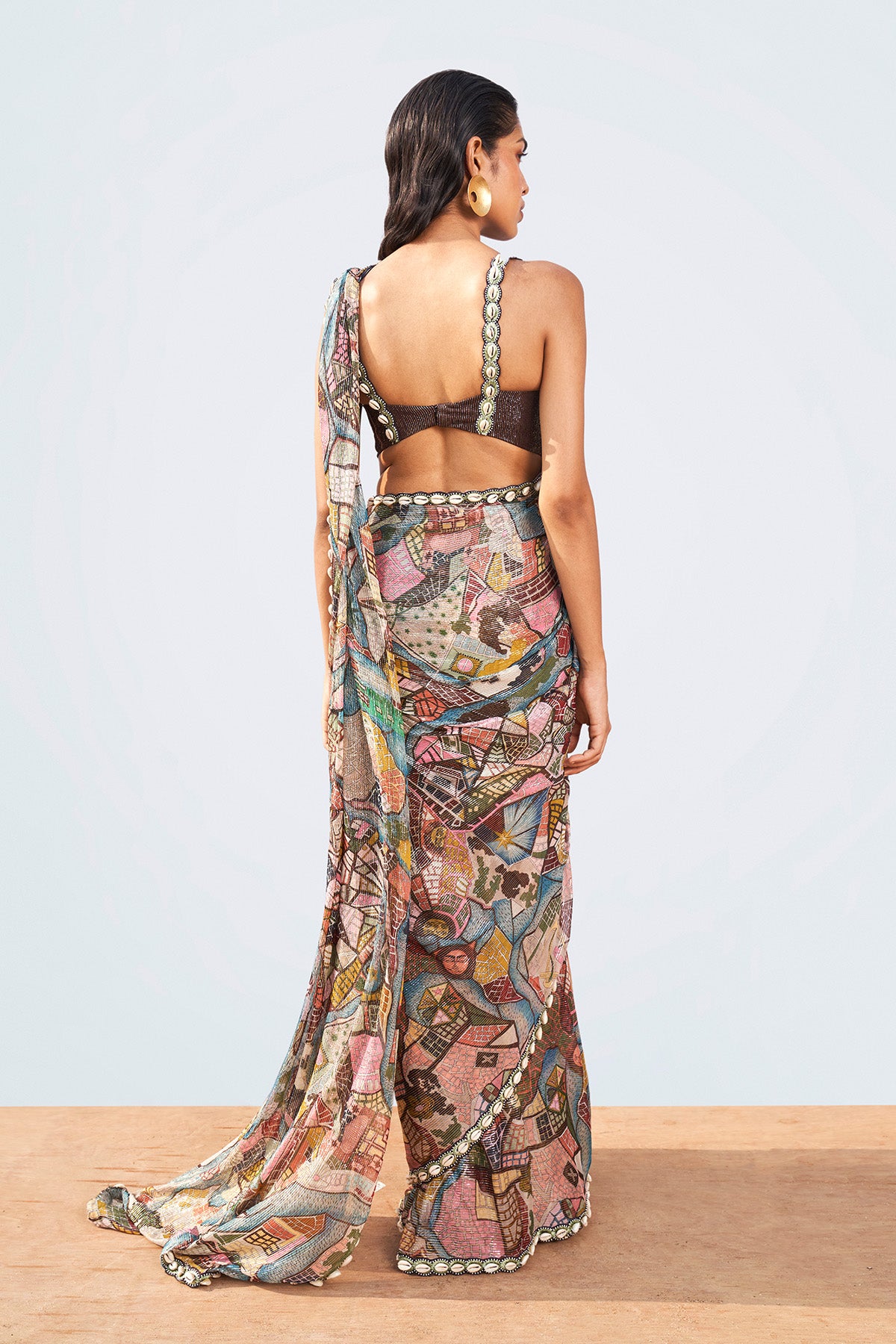 Right side view of printed saree and shell trim blouse.
