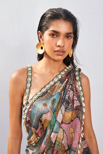 Close-up of saree print and shell trim detail on blouse front.