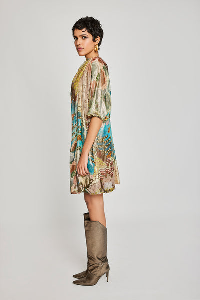 Close-up of dobby fabric texture and draping details on dress front.

