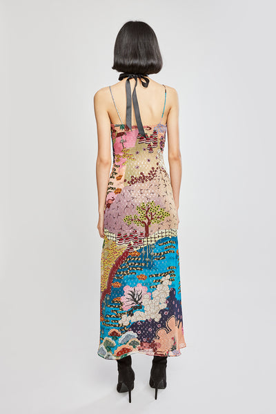 Rear silhouette showing dress flow and fabric continuity