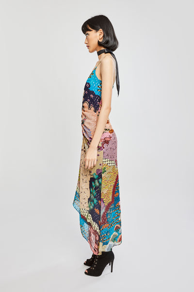 Side silhouette showing dress flow and ruched waist detail