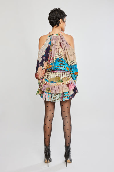 Rear silhouette showing dress flow and fabric continuity