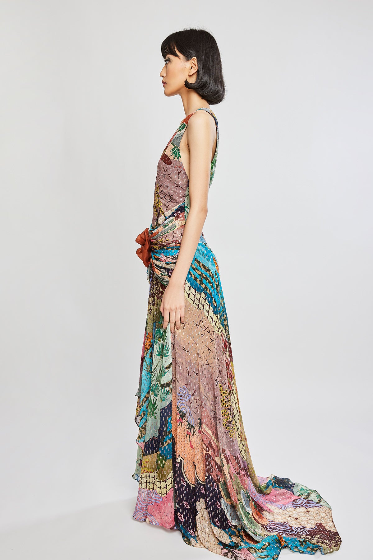Left side view of Trencadís dobby maze maxi dress with asymmetric hemline
