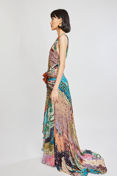 Left side view of Trencadís dobby maze maxi dress with asymmetric hemline