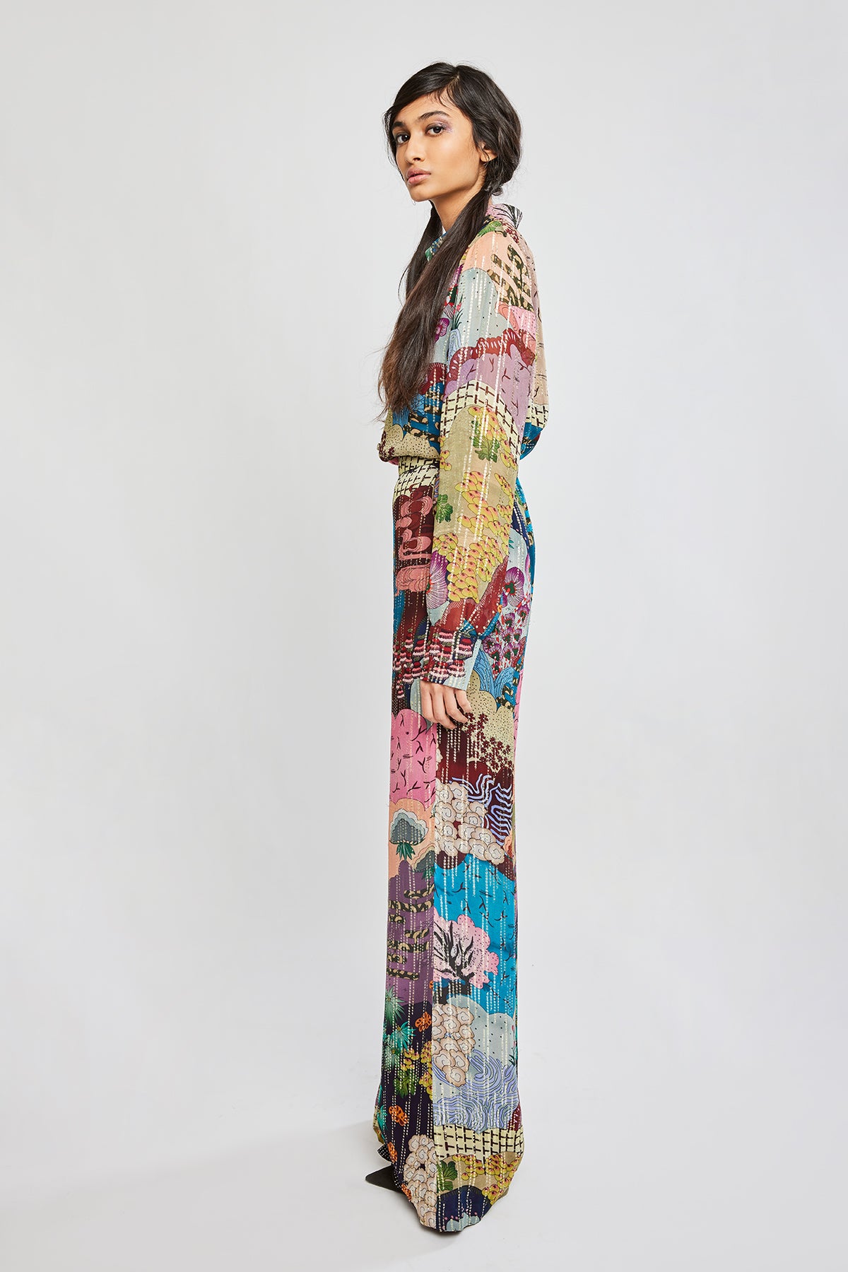 Left profile of multi-color dobby maze shirt and wide-legged pants