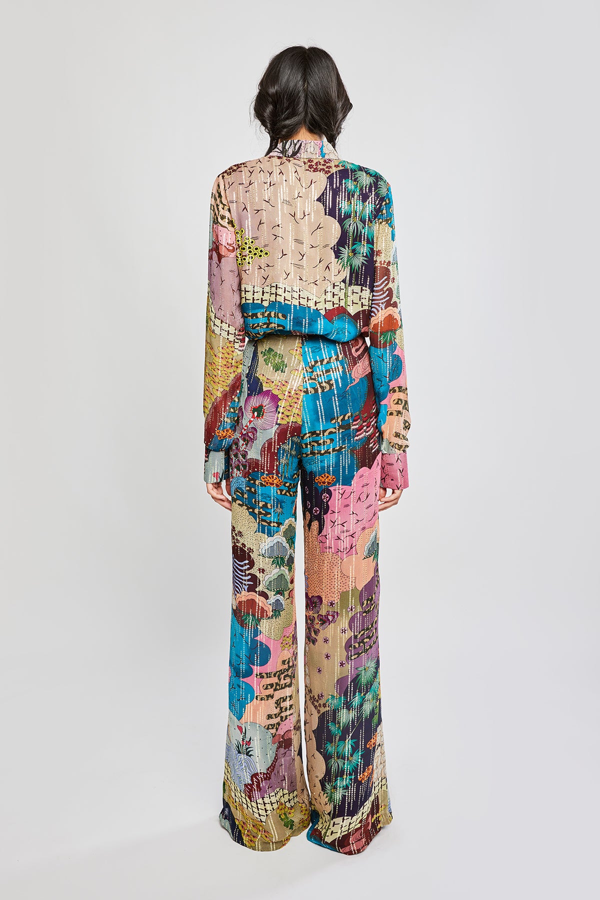 Rear silhouette showing shirt fit and pant flow