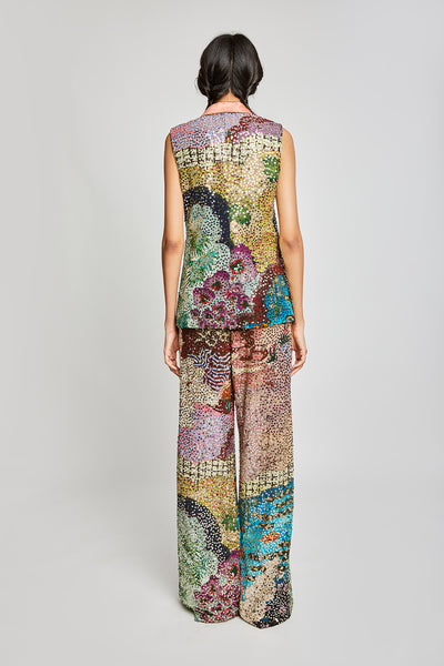 Back profile showing the maze sequined jacket and structured pants.