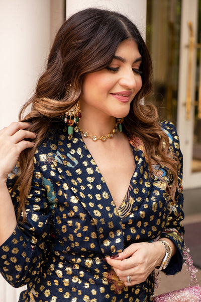 Left profile of navy blue dobby blazer and wide leg pants.