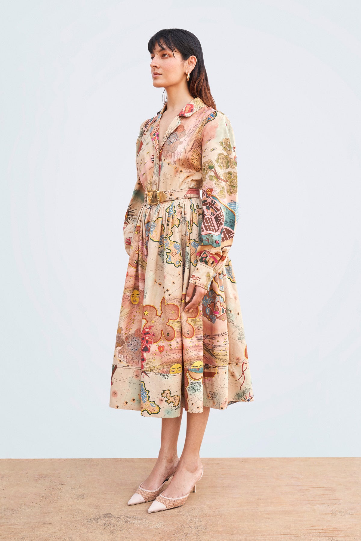 Close-up of collar, pleats, and stitching on left side.