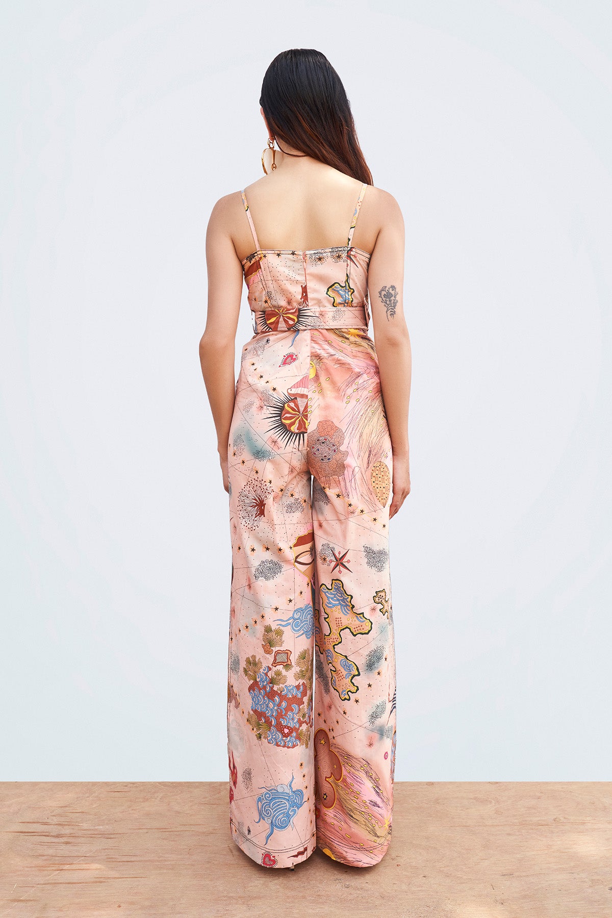 Right side view of printed jumpsuit.