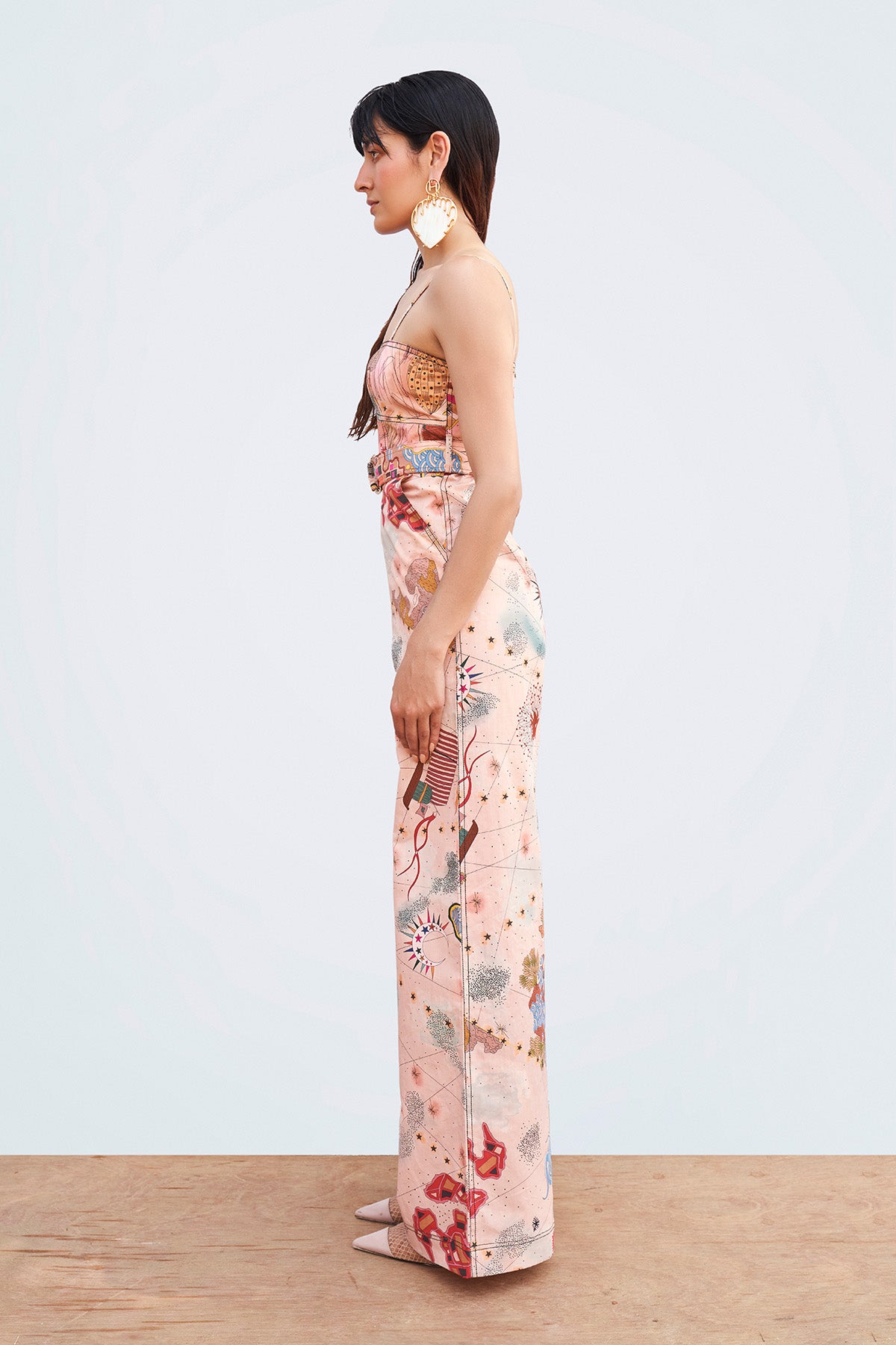 Close-up of fabric print and stitching on left side.

