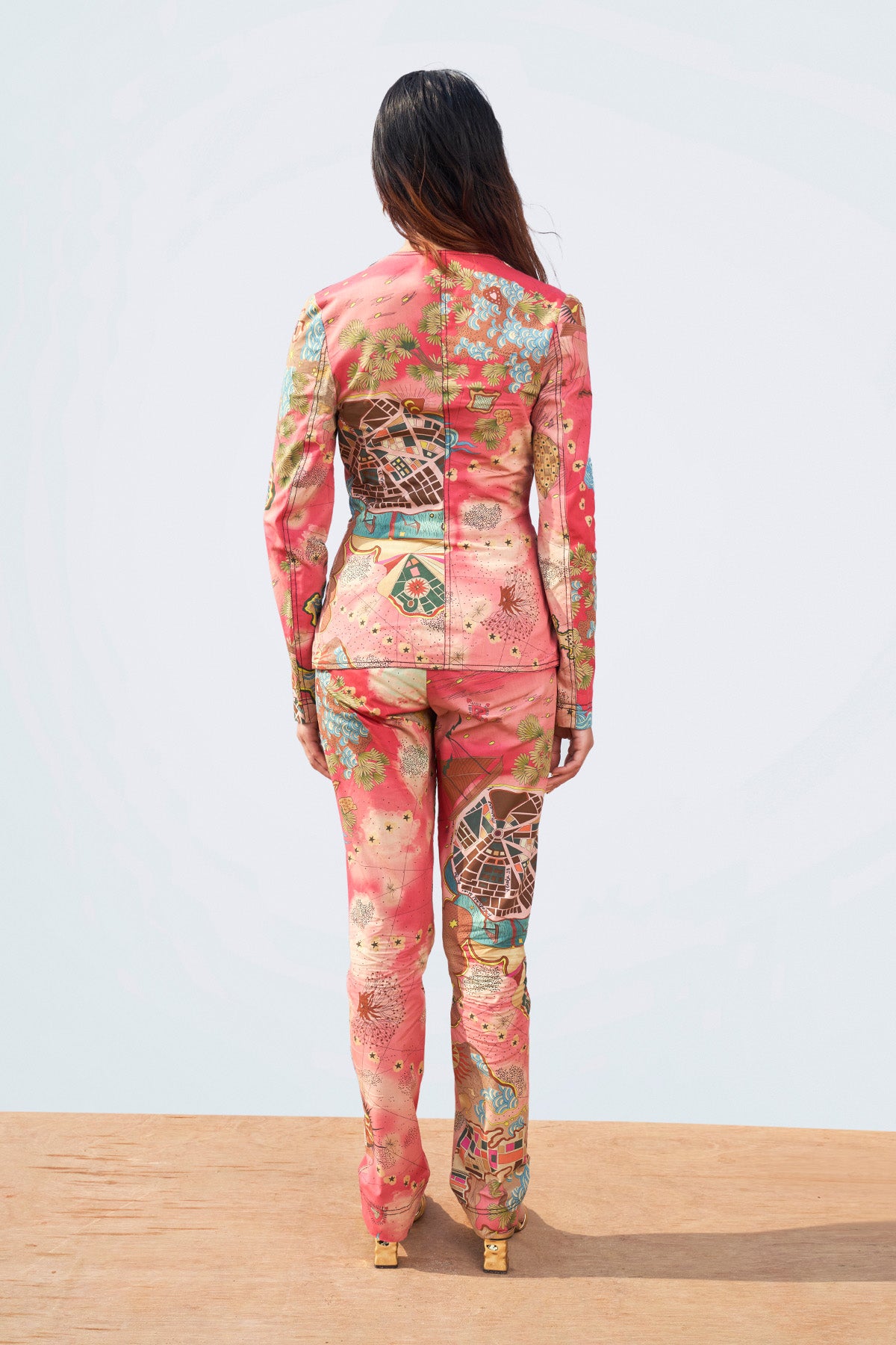 Right side view of printed blazer and pant set.