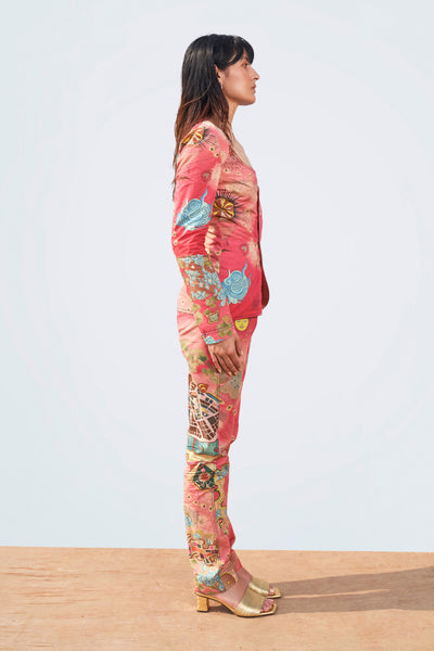 Left profile of pink poplin print blazer and pant set.