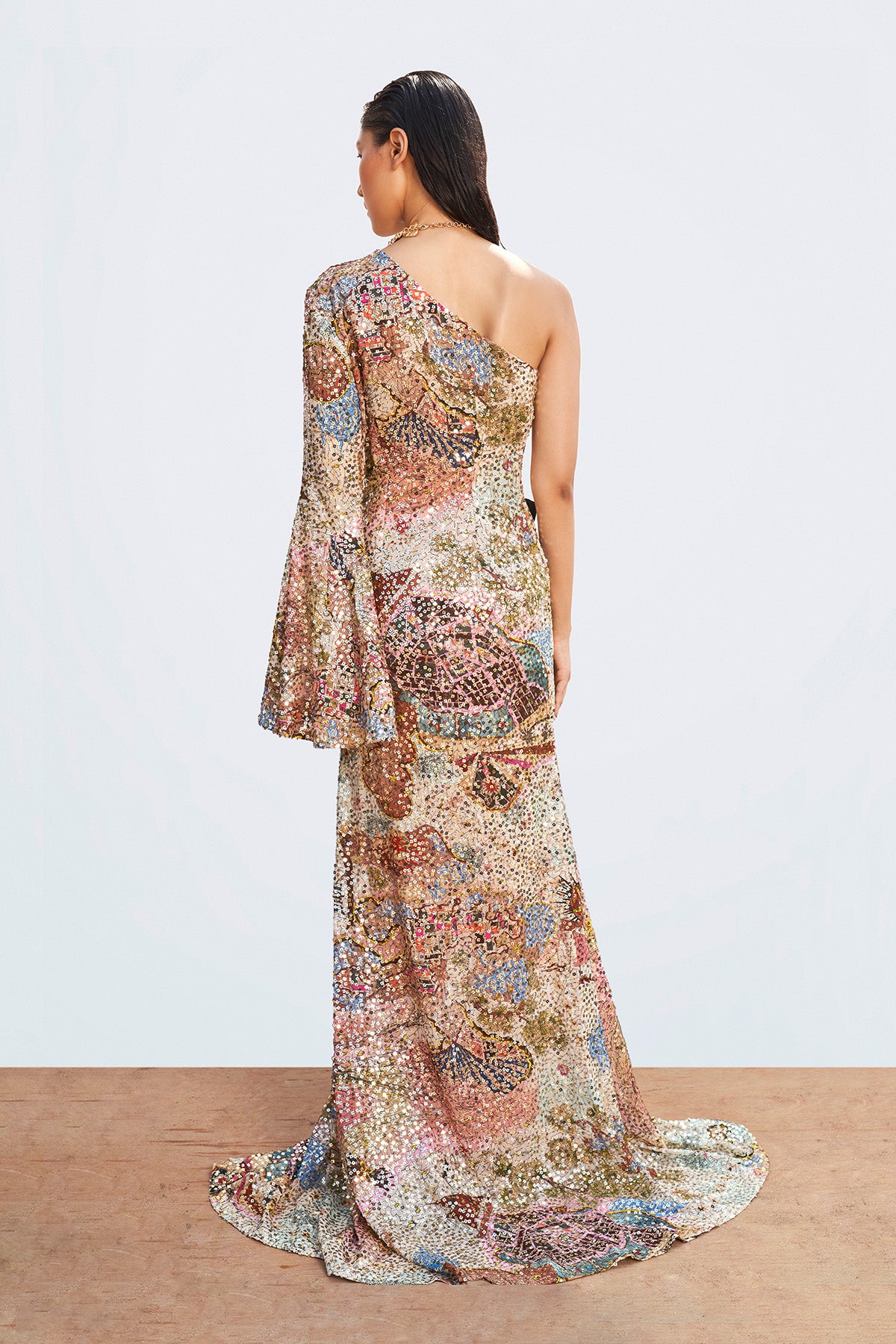 Back profile showcasing Roshni Chopra in the Muse multicolor sequined gown with shimmering couture finish