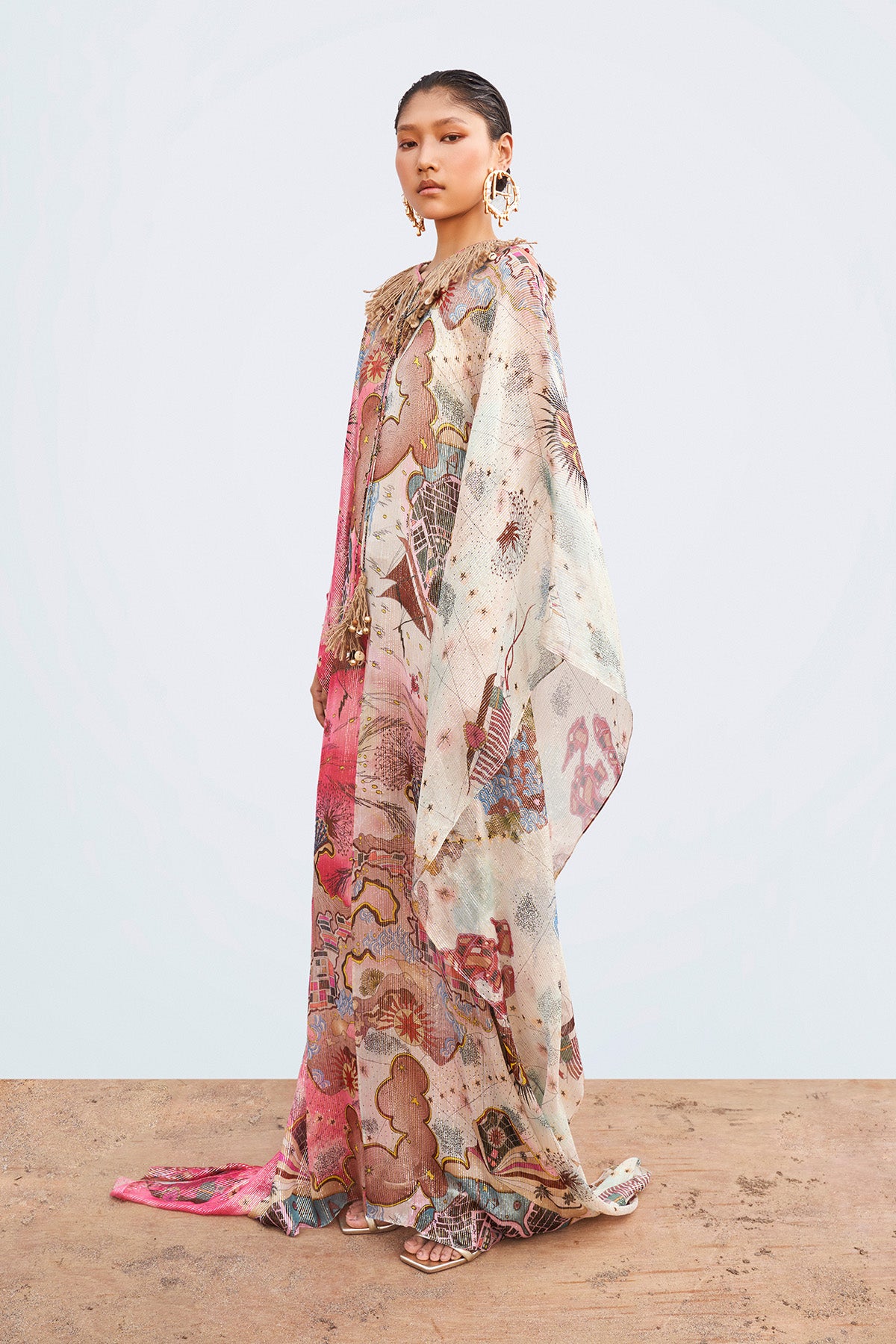 Left side view of multi-color Starboard & Port printed kaftan with embellished neckline trim