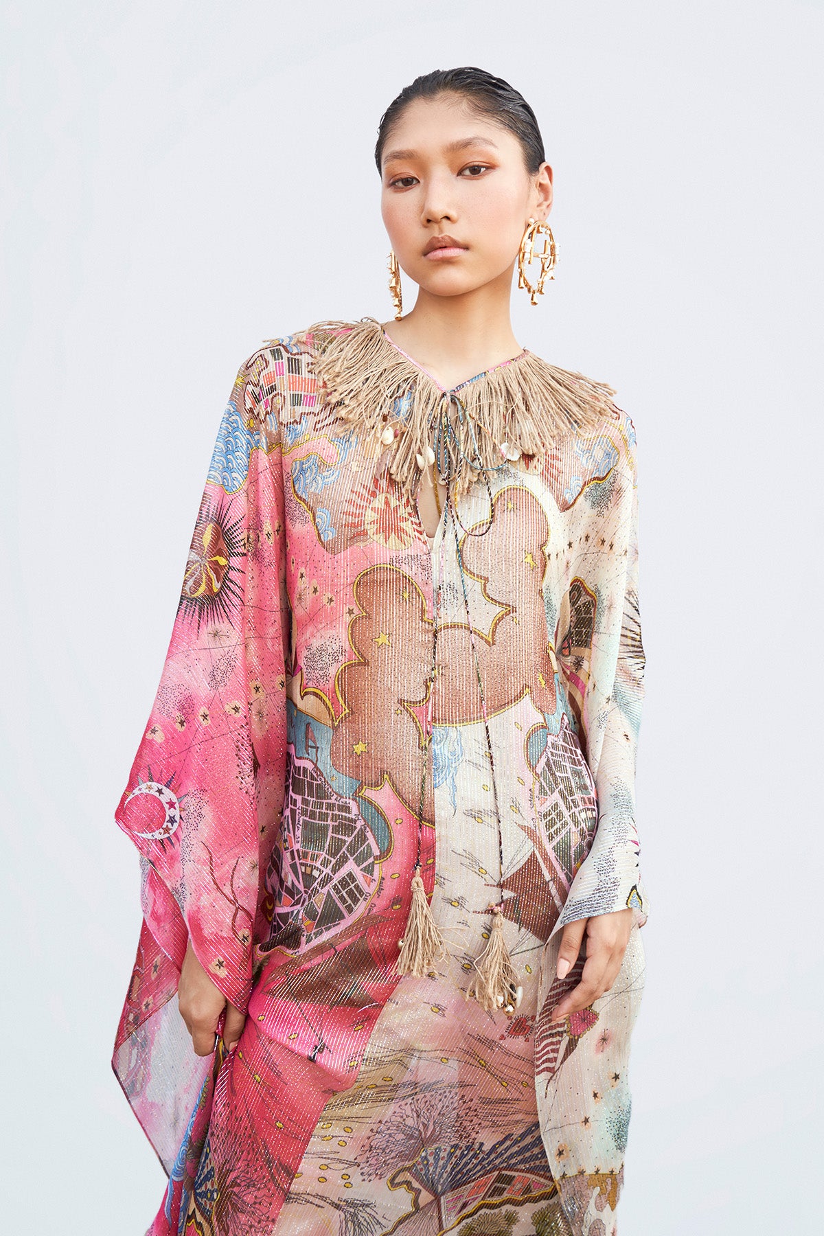 Close-up of front print and embellished neckline on kaftan
