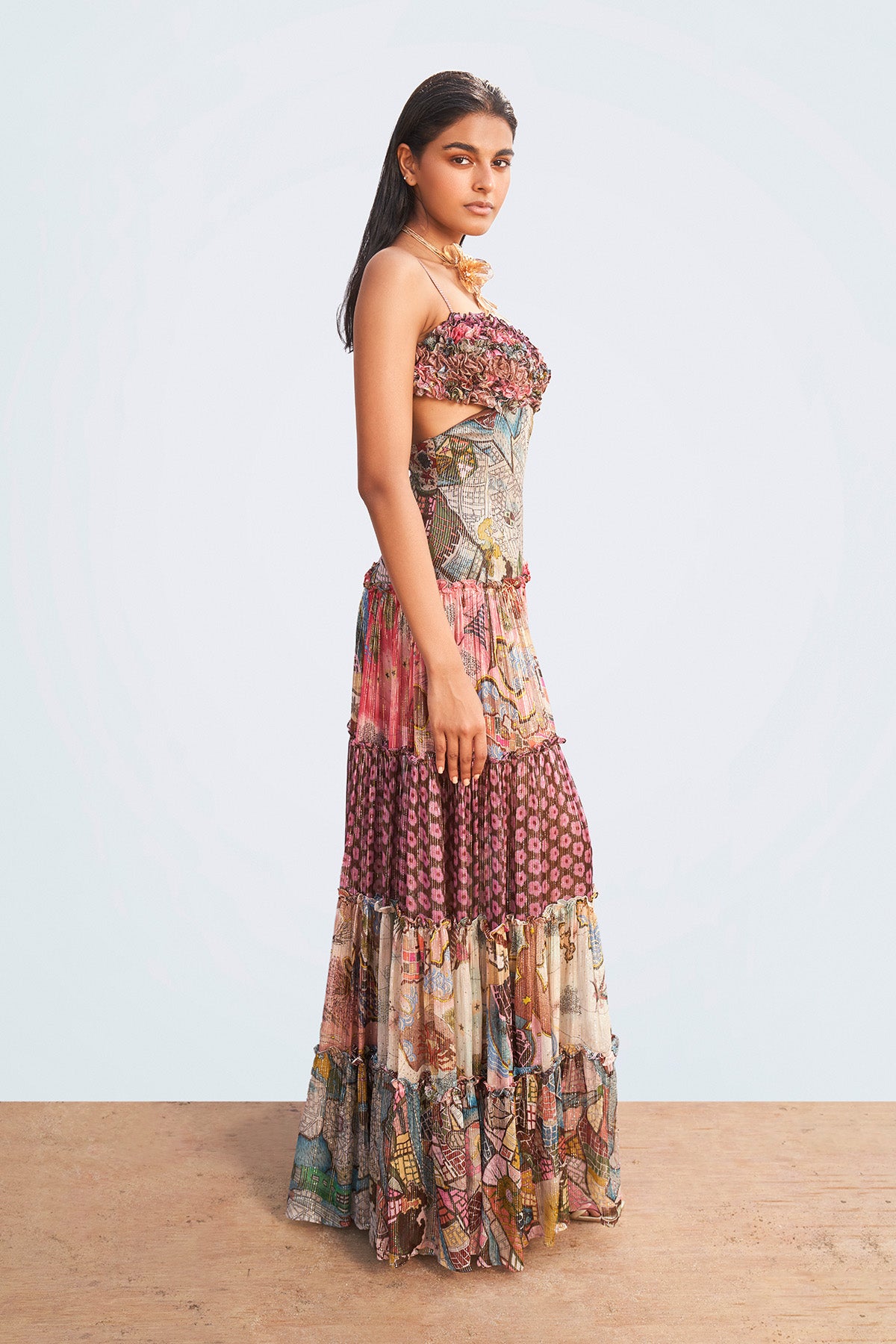 Left profile of printed maxi dress with ruffle trims.

