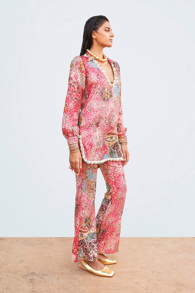 Left profile of Viva Magenta sequin appliqué dress tunic and trousers.