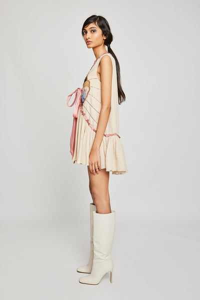 Left side view of Trencadís beige dobby appliquéd dress