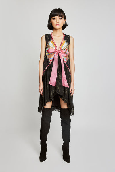 Front view of Trencadís black dobby appliquéd dress with bow-tie detailing

