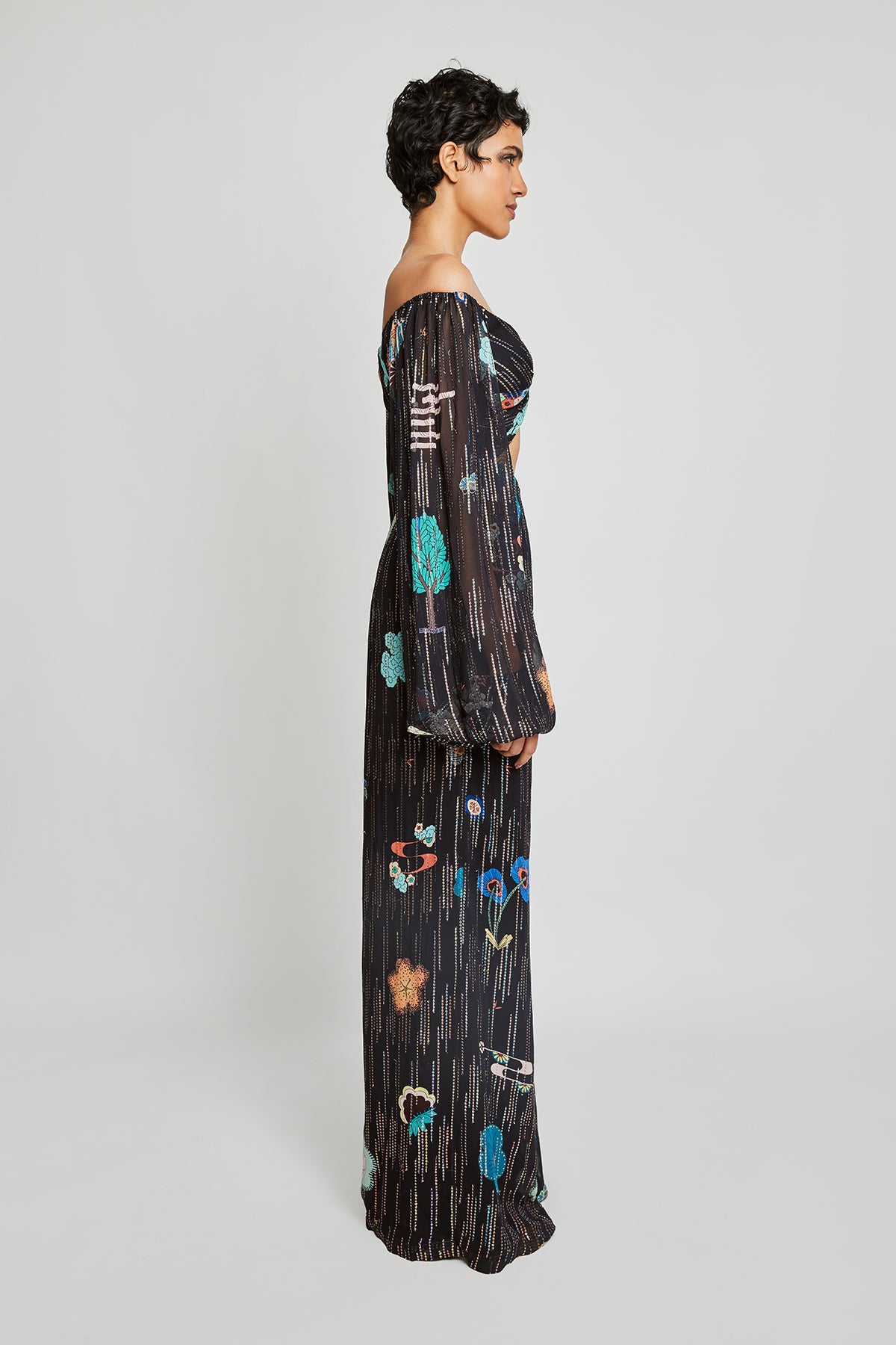 Close-up of front knot and puff sleeves on black jumpsuit