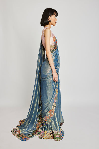 Left profile of blue dobby pre-draped saree and embroidered blouse.