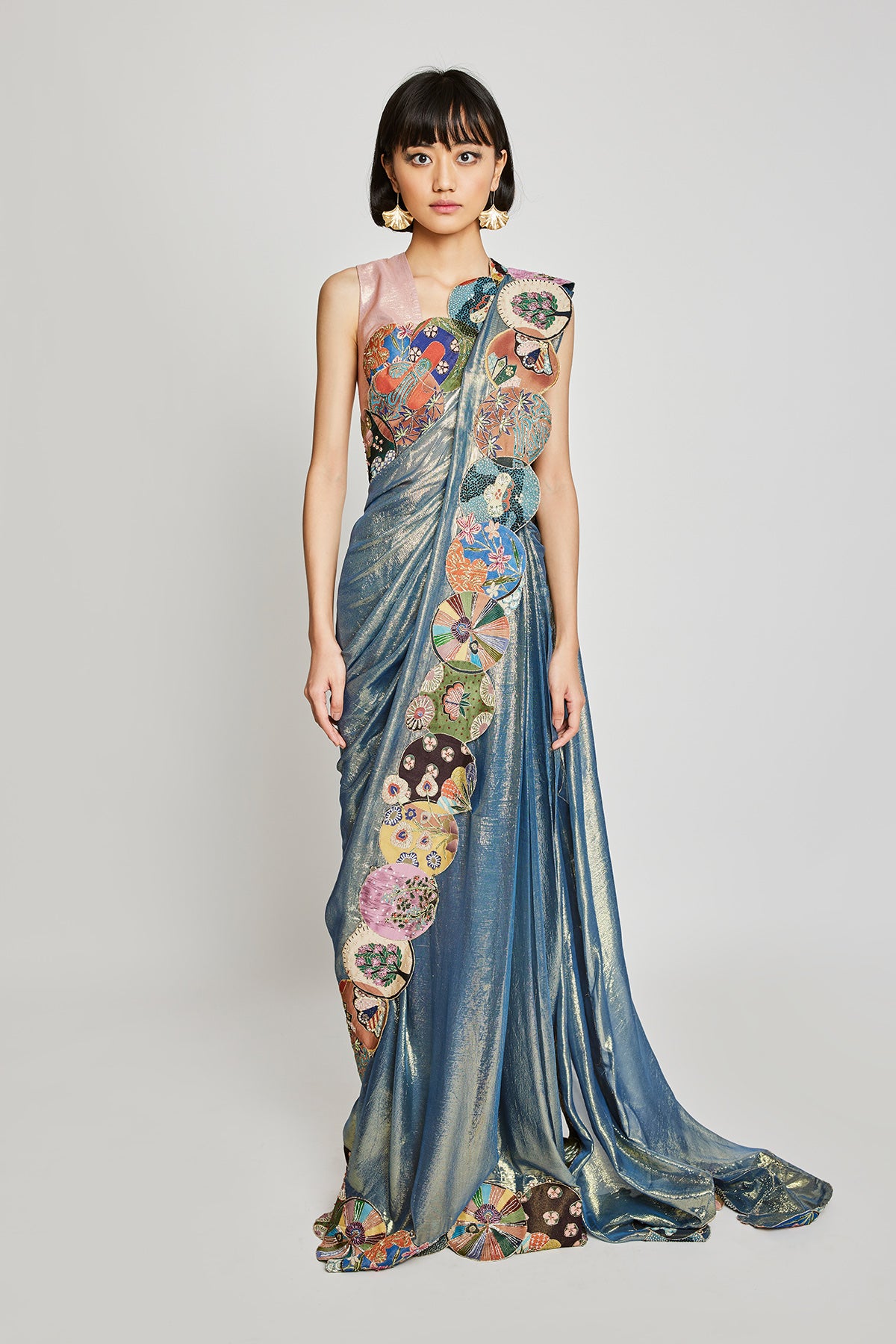 Front view of Trencadís blue dobby pre-draped saree with embellished circle border.