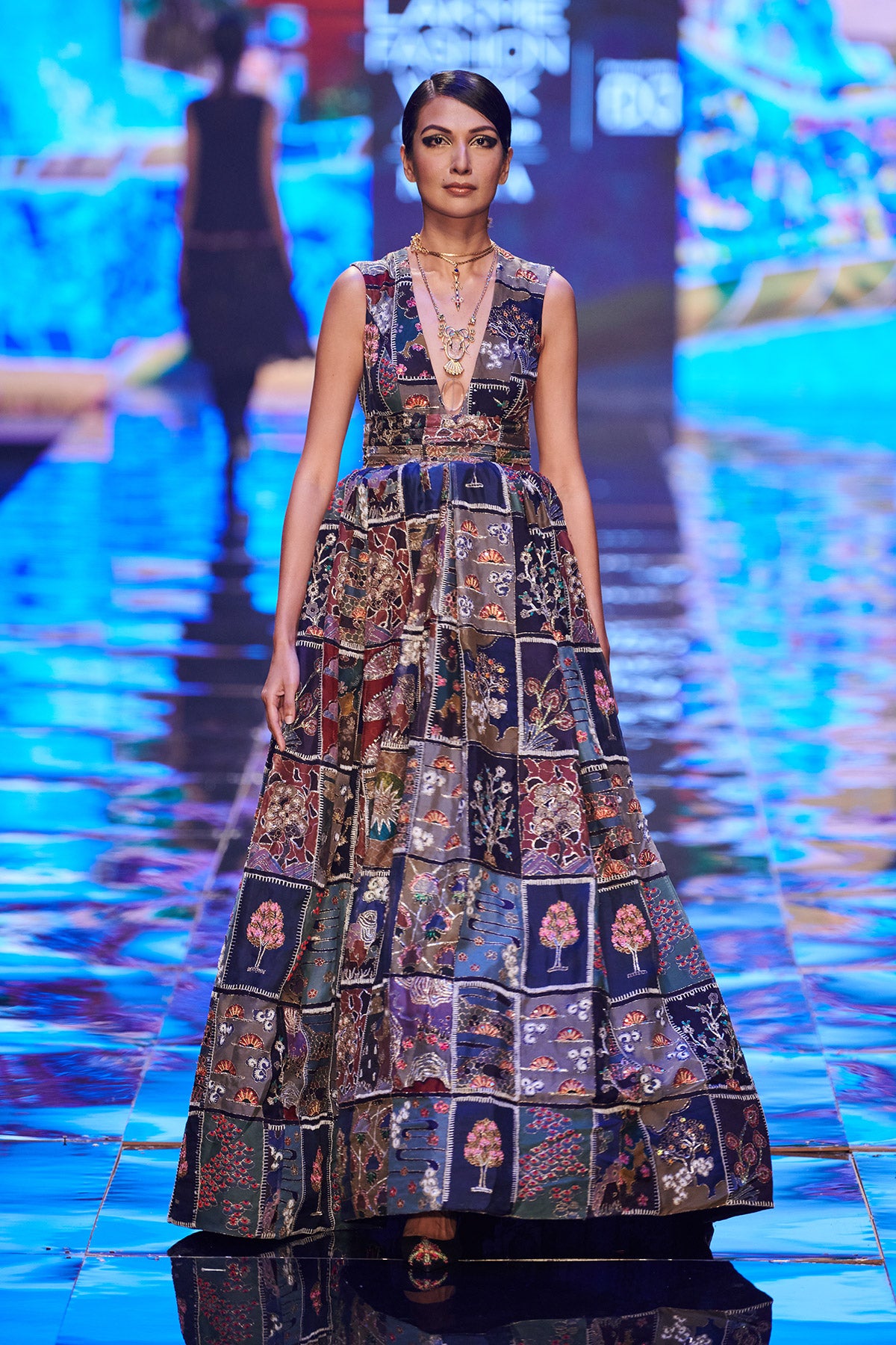 Front view of Trencadís frames embellished blue gown.