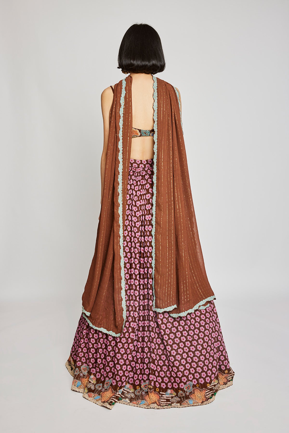 Close-up of the right side floral embellishments on the Trencadís brown dobby lehenga set