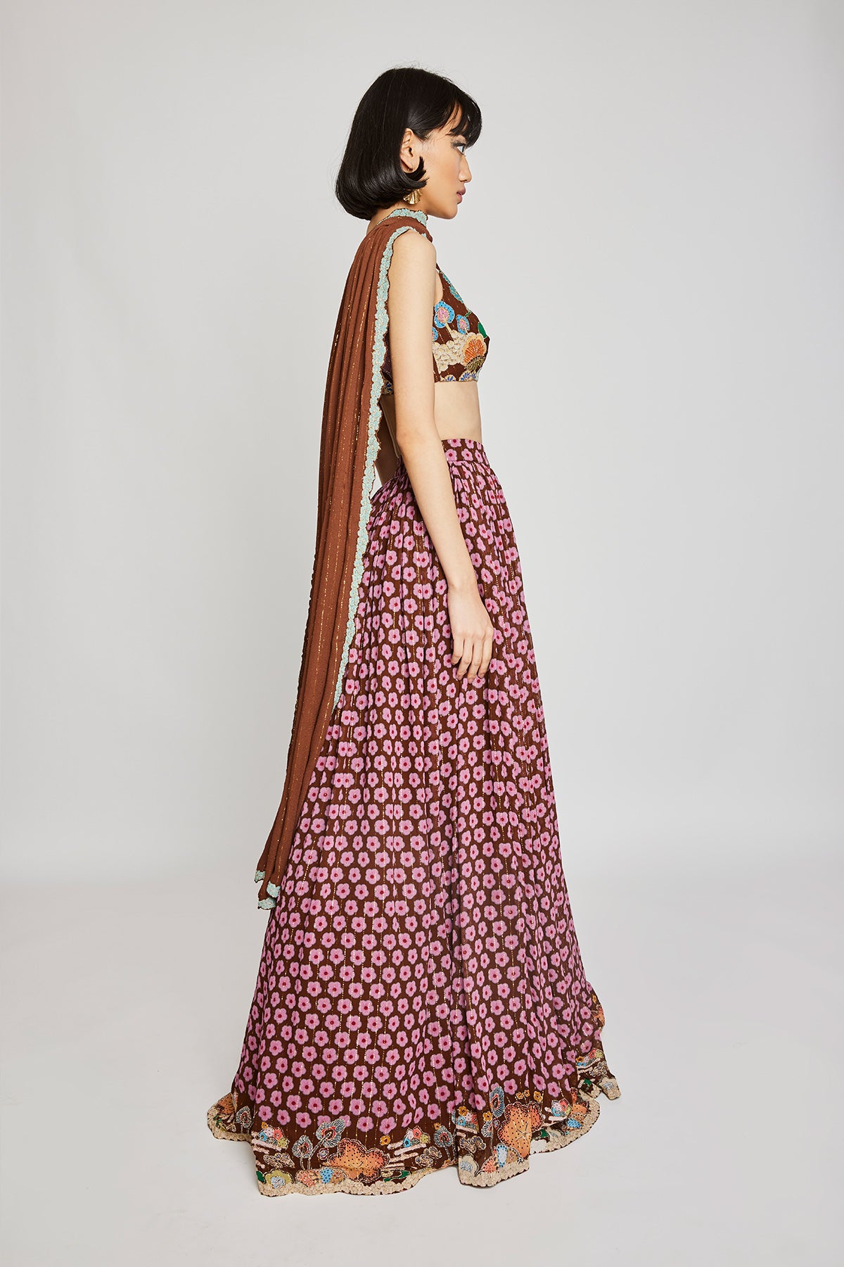 Close-up of the front floral embellishments on the Trencadís brown dobby lehenga set