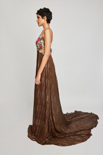 Left side view of the Trencadís brown dobby appliquéd and embellished trail gown