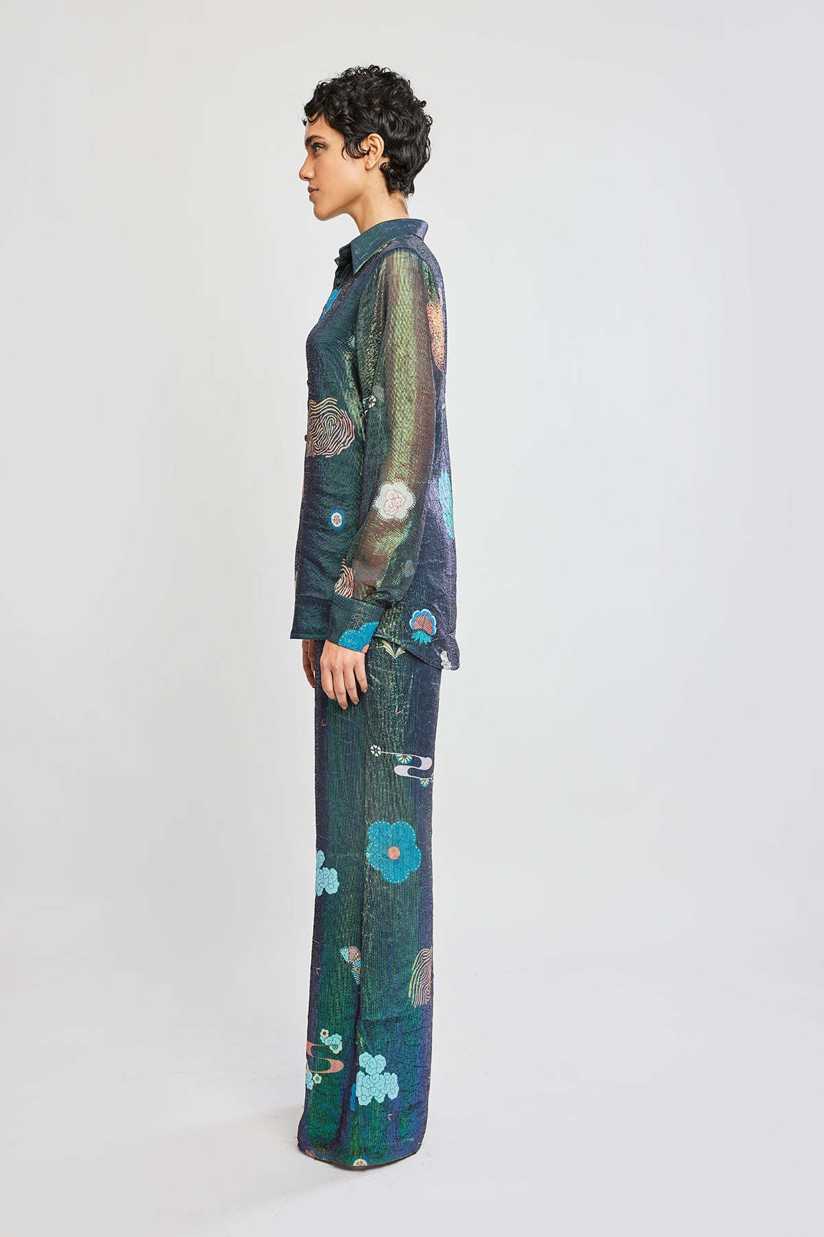 Left side view of Trencadís green dobby button down shirt with wide leg pants