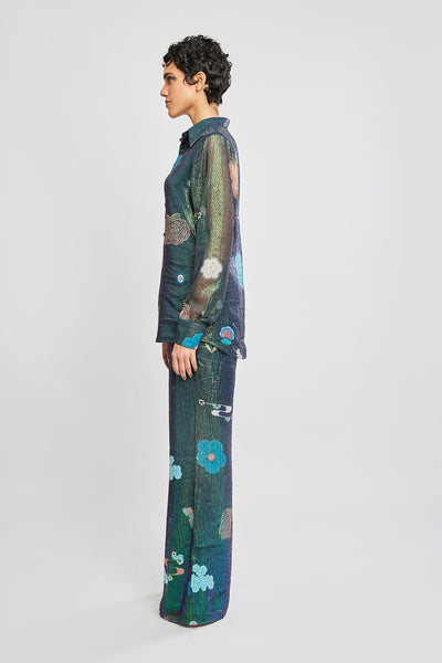 Left side view of Trencadís green dobby button down shirt with wide leg pants