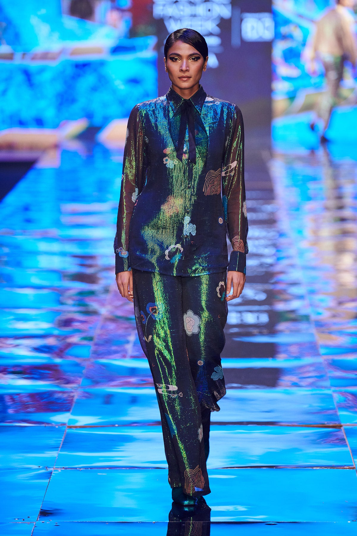  Right side view of Trencadís green dobby button down shirt with wide leg pants