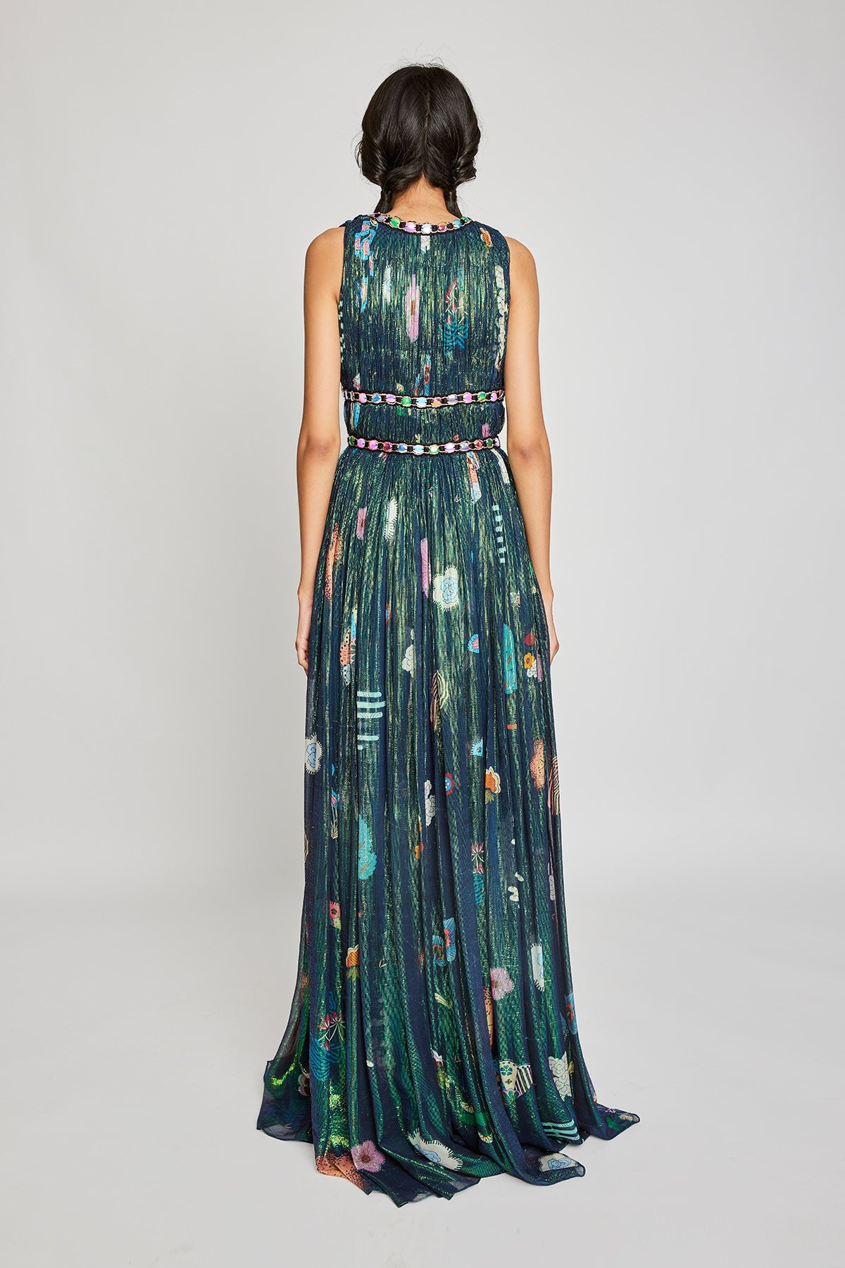 Close-up of the left side ruched details on the Trencadís green gown