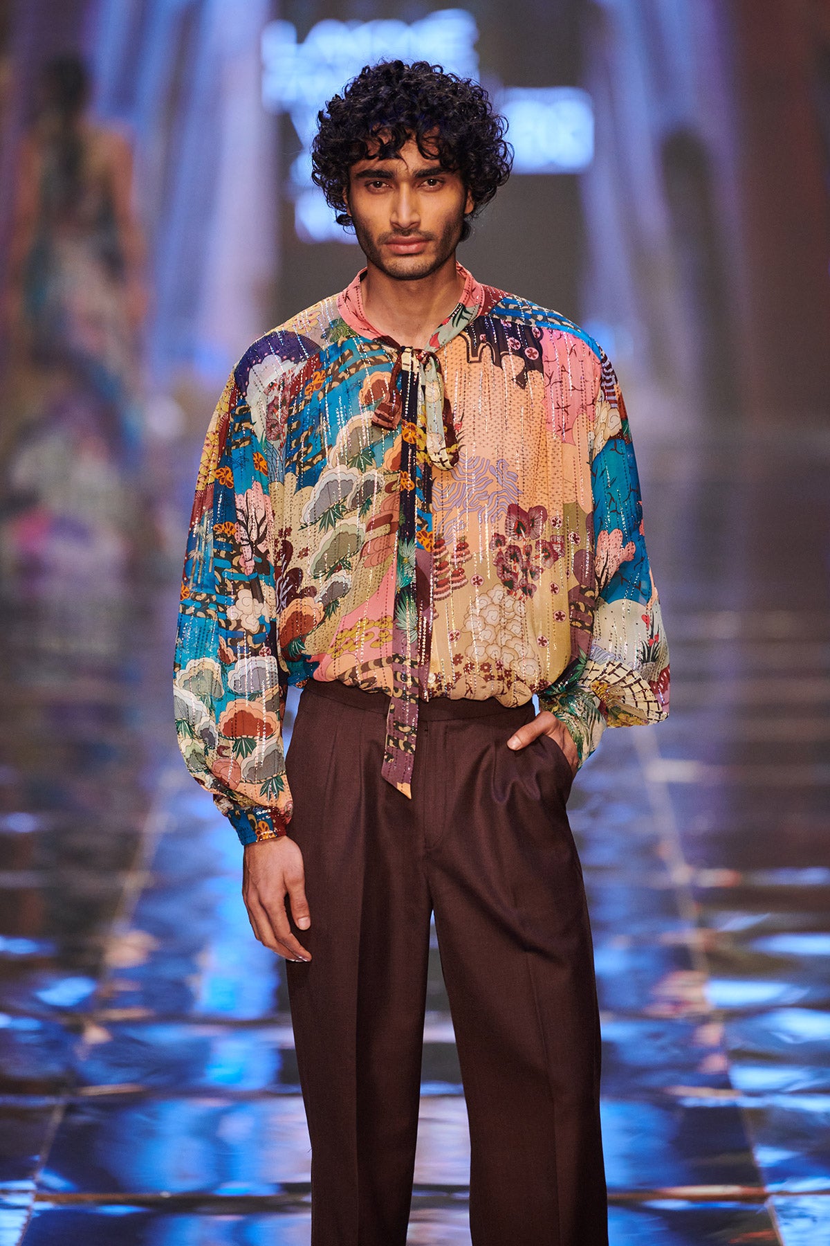 Close-up of embellishments and fabric texture on gown front.