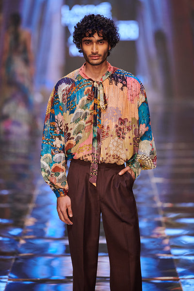 Close-up of embellishments and fabric texture on gown front.