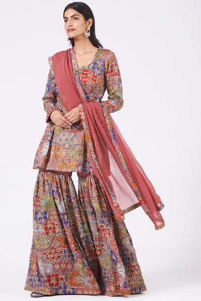 Left side view of peach scallop juna sharara set