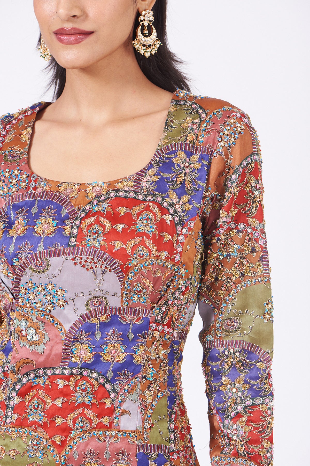 Close-up of front scallop details on peach sharara set