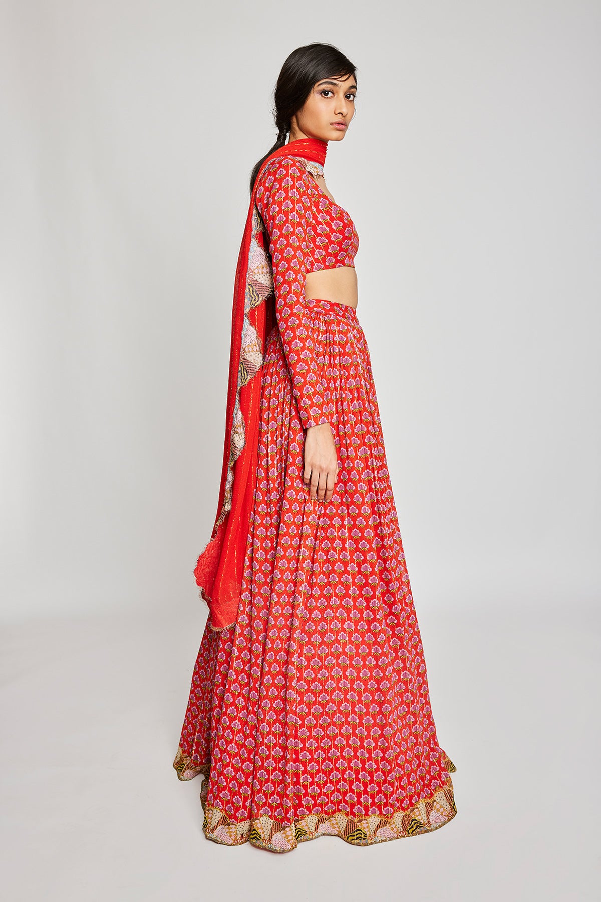 Close-up of the front detailing on the Trencadís red dobby embellished lehenga set