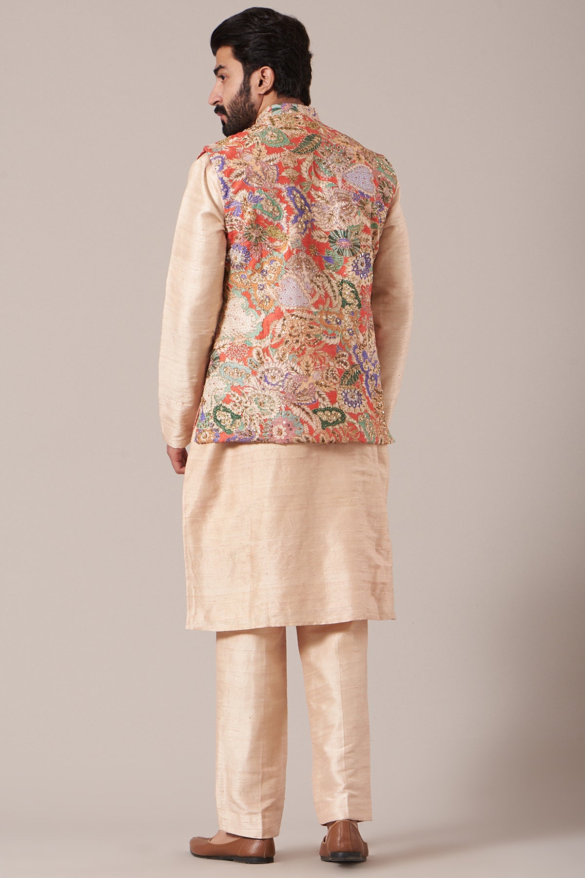 Back view of red juna raw silk printed and embellished bundi with cream raw silk kurta and pants