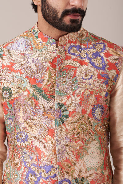 Close-up of front print and embellishments on red bundi and cream kurta