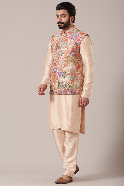 Left side view of red juna raw silk printed and embellished bundi with cream raw silk kurta and pants
