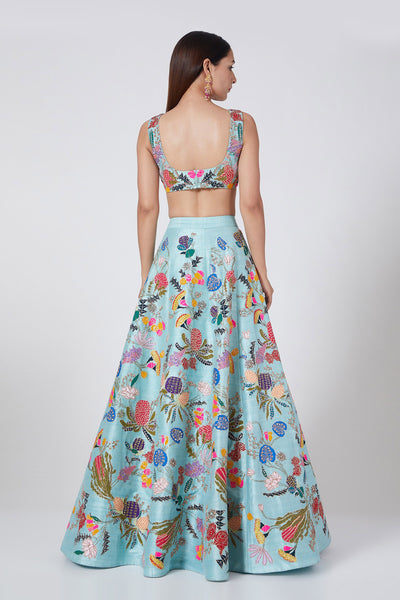 Back view of Avatar Blue pastiche raw silk appliquéd lehenga with blouse and cutwork tulle dupatta