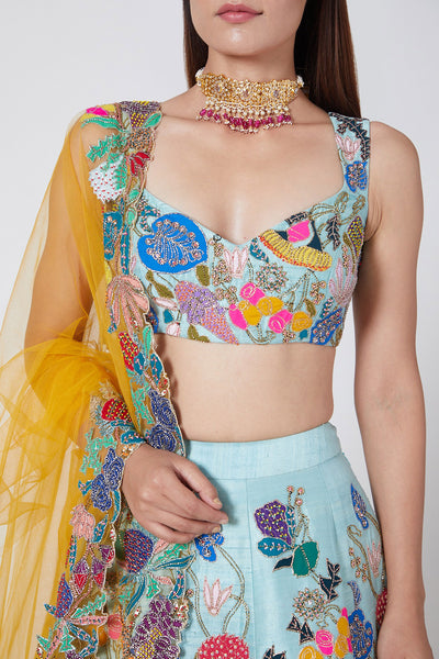Close-up of front appliqué and embellishments on Avatar Blue lehenga set