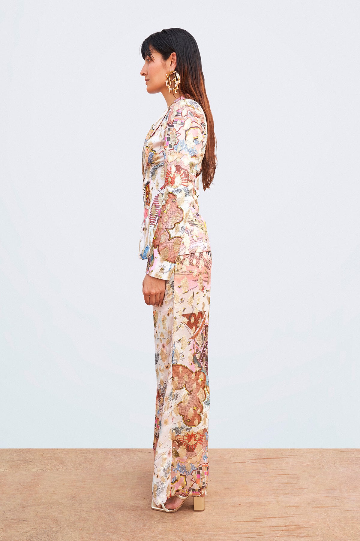 Left profile of Ivory printed jacket and trousers set.