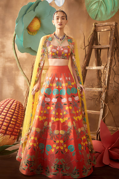 Front view of orange pastiche raw silk appliquéd lehenga with blouse and cutwork dupatta