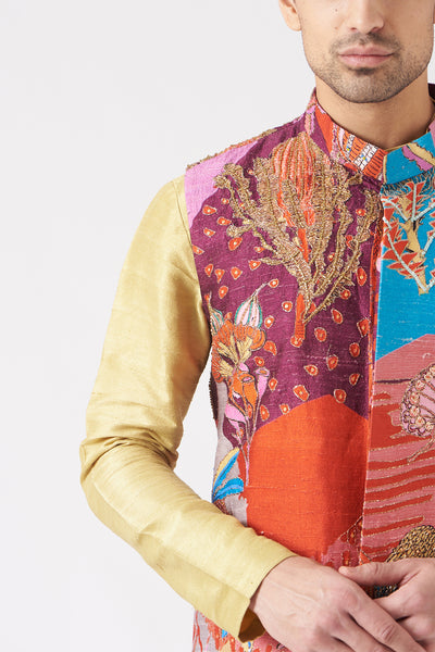 Close-up of front print and embellishments on plum bundi and kurta