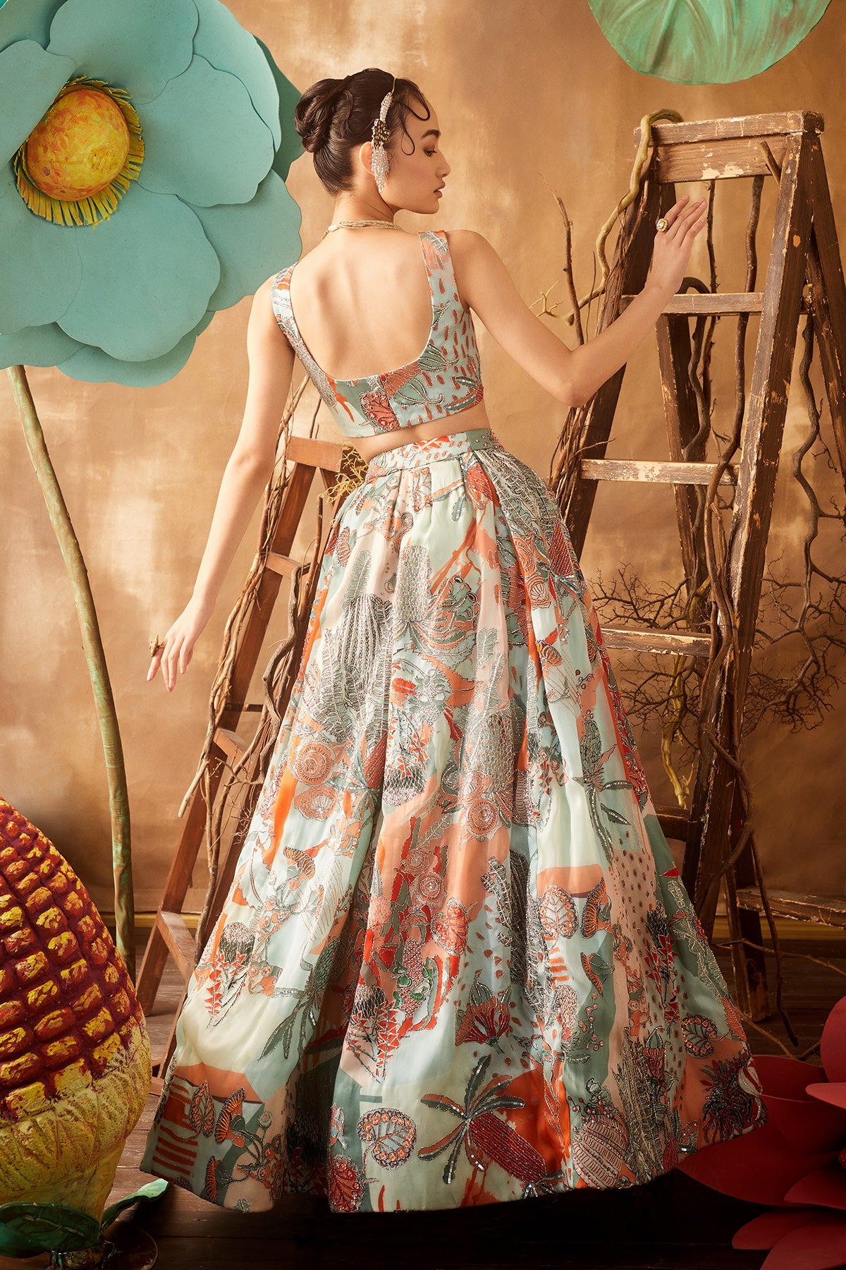 Back view of powder blue pastiche organza printed and embellished top and skirt with cutwork dupatta
