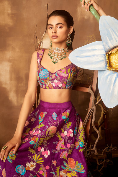 Left side view of purple pastiche raw silk appliquéd lehenga with blouse and cutwork dupatta